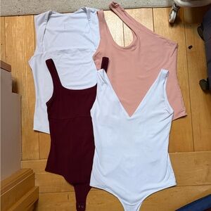 Four bodysuits- M